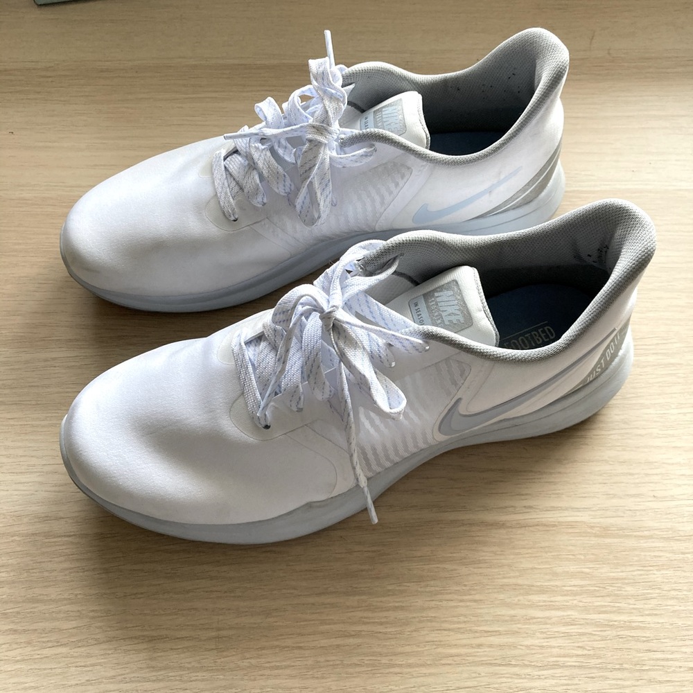 White, blue, and grey Nike training shoes